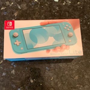 NWT Nintendo Switch Lite in Teal. Price firm.